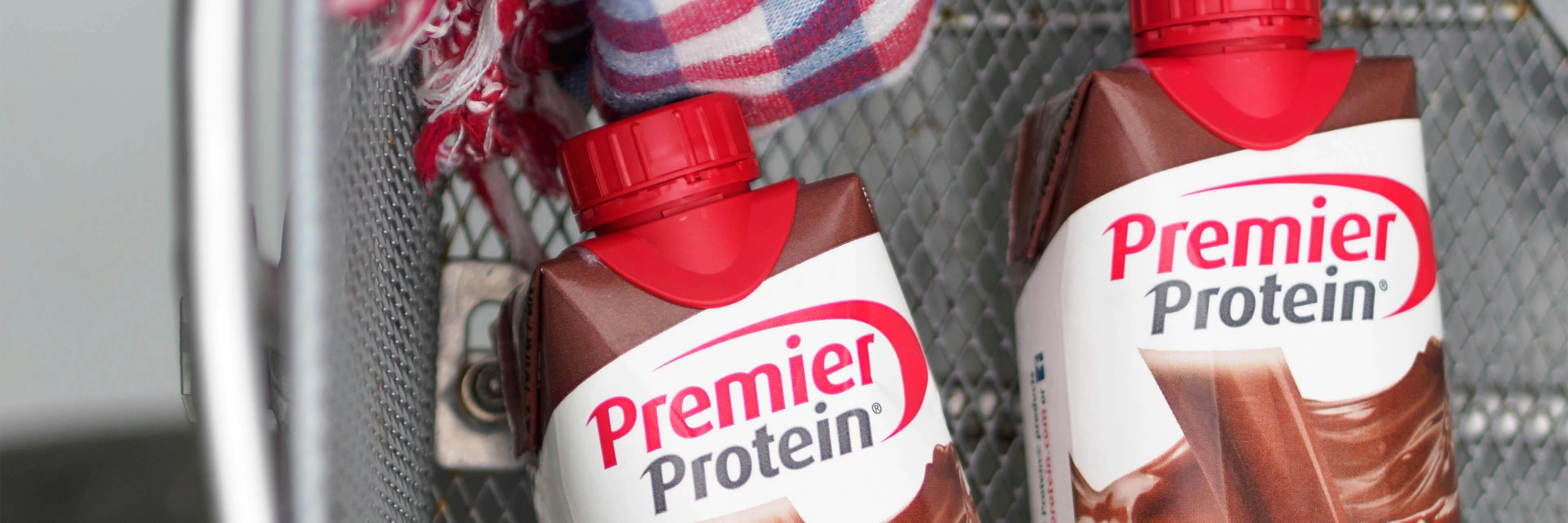 Two Premier Protein shakes in a locker.